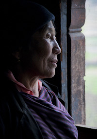 Bhutan woman by window